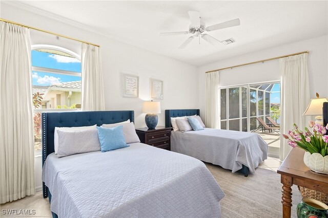 3615 Tripoli Blvd, Punta Gorda, FL 33950 - bedroom featuring access to exterior, light carpet, and a ceiling fan