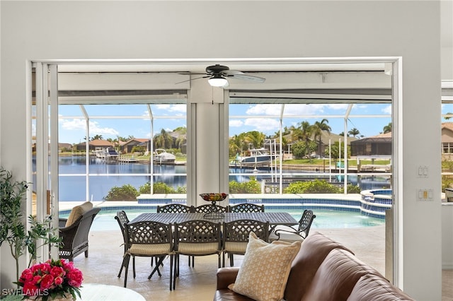 3615 Tripoli Blvd, Punta Gorda, FL 33950 - dining room featuring ceiling fan, a water view, and a sunroom