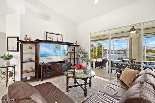 3615 Tripoli Blvd, Punta Gorda, FL 33950 - living area featuring vaulted ceiling, tile patterned floors, and a ceiling fan