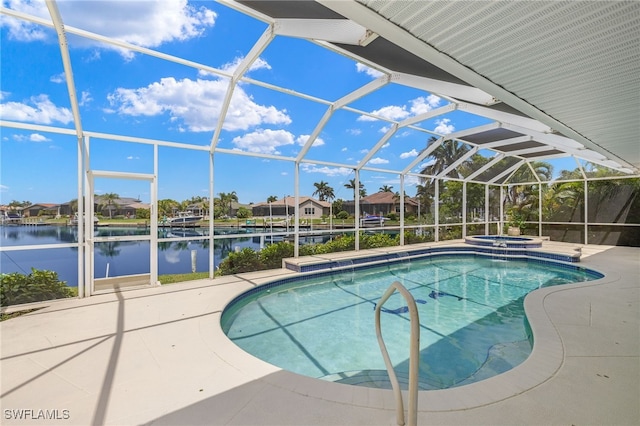 3615 Tripoli Blvd, Punta Gorda, FL 33950 - view of pool featuring a patio, a water view, a pool with connected hot tub, and a lanai