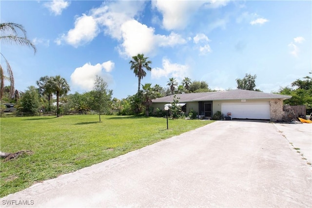 17041 Tarpon Way N, Fort Myers, FL 33917 - view of front of house with an attached garage, driveway, and a front yard