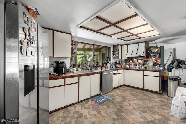 17041 Tarpon Way N, Fort Myers, FL 33917 - kitchen featuring stainless steel appliances, dark countertops, white cabinetry, and stone finish flooring