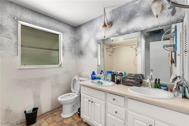 17041 Tarpon Way N, Fort Myers, FL 33917 - bathroom featuring double vanity, a shower, and stone finish floors