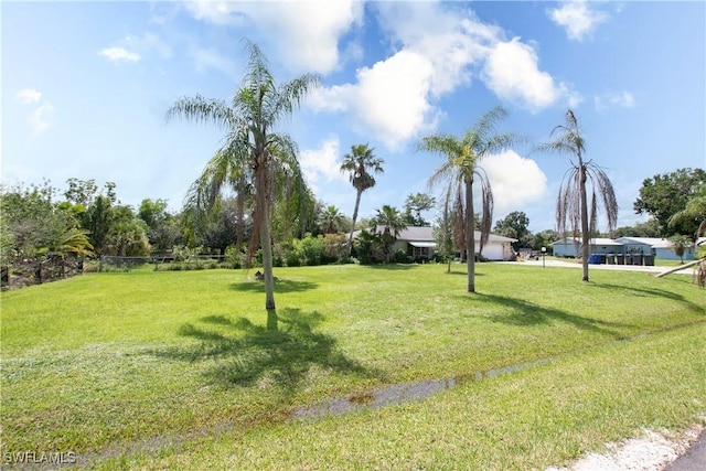 17041 Tarpon Way N, Fort Myers, FL 33917 - view of home's community with a lawn