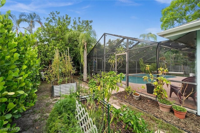 770 Wilson Ave, Fort Myers, FL 33919 - view of yard featuring an outdoor pool and a garden