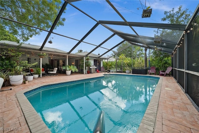 770 Wilson Ave, Fort Myers, FL 33919 - swimming pool featuring a patio, glass enclosure, and grilling area