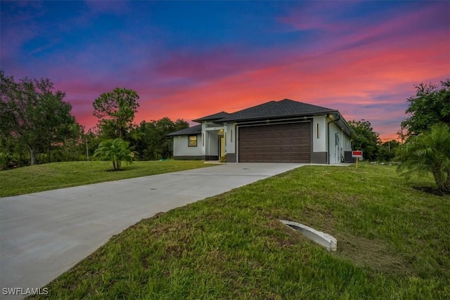 1220 Edward Ave, Lehigh Acres, FL 33972 - ranch-style home with a garage, driveway, a front yard, and stucco siding
