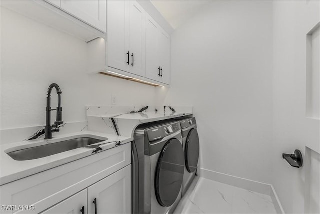 1220 Edward Ave, Lehigh Acres, FL 33972 - laundry area featuring separate washer and dryer, cabinet space, and marble finish flooring
