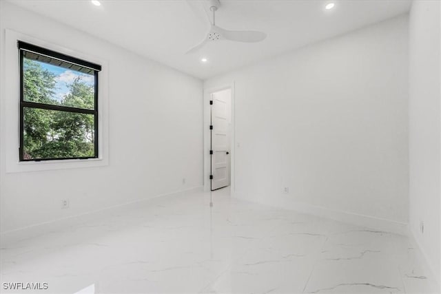1220 Edward Ave, Lehigh Acres, FL 33972 - spare room featuring light marble finish floors, recessed lighting, and ceiling fan