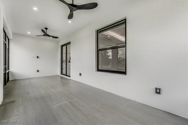 1220 Edward Ave, Lehigh Acres, FL 33972 - empty room with a ceiling fan and recessed lighting