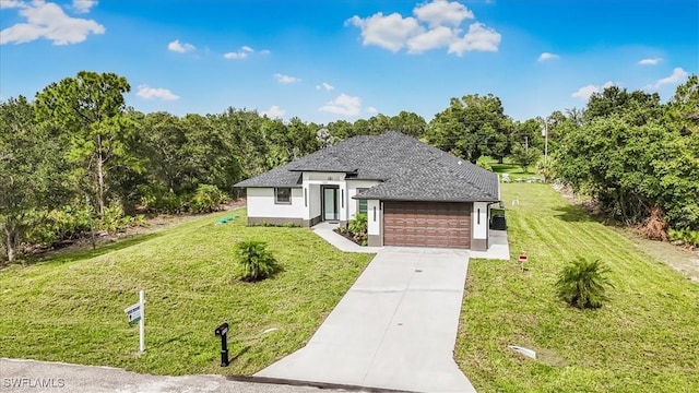 1220 Edward Ave, Lehigh Acres, FL 33972 - view of front of house with a garage, a front yard, driveway, and stucco siding