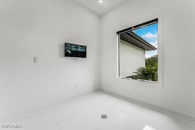 1220 Edward Ave, Lehigh Acres, FL 33972 - spare room featuring marble look tiles