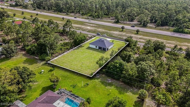 1220 Edward Ave, Lehigh Acres, FL 33972 - drone / aerial view of a pool area