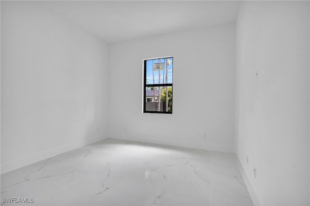 3202 21st St W, Lehigh Acres, FL 33971 - empty room with baseboards and marble finish floors