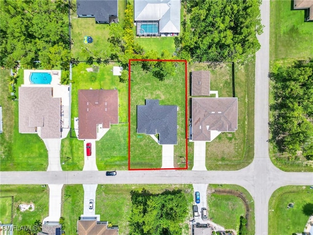 3202 21st St W, Lehigh Acres, FL 33971 - aerial view of property's location featuring a pool and property parcel outlined