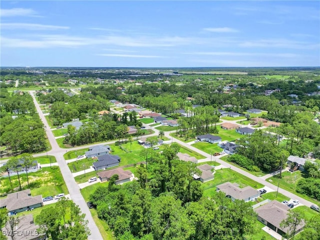 3202 21st St W, Lehigh Acres, FL 33971 - aerial view of property and surrounding area featuring nearby suburban area