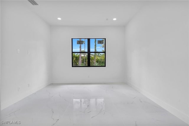 3202 21st St W, Lehigh Acres, FL 33971 - unfurnished room with marble finish flooring and recessed lighting