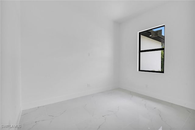 3202 21st St W, Lehigh Acres, FL 33971 - spare room with baseboards and marble finish flooring