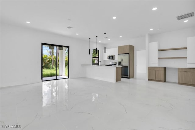 3202 21st St W, Lehigh Acres, FL 33971 - unfurnished living room with recessed lighting and light marble finish flooring