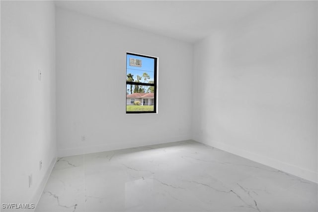 3202 21st St W, Lehigh Acres, FL 33971 - spare room featuring marble finish flooring and baseboards