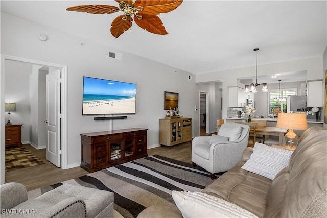 3760 Sawgrass Way Unit 3514, Naples, FL 34112 - living room with a chandelier, wood finished floors, and a ceiling fan