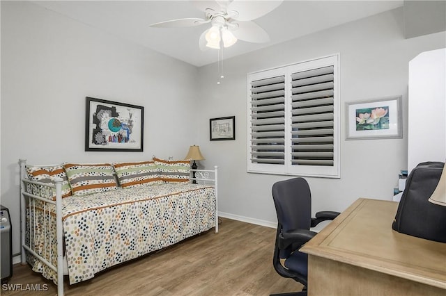 3760 Sawgrass Way Unit 3514, Naples, FL 34112 - bedroom with wood finished floors, a desk, and ceiling fan