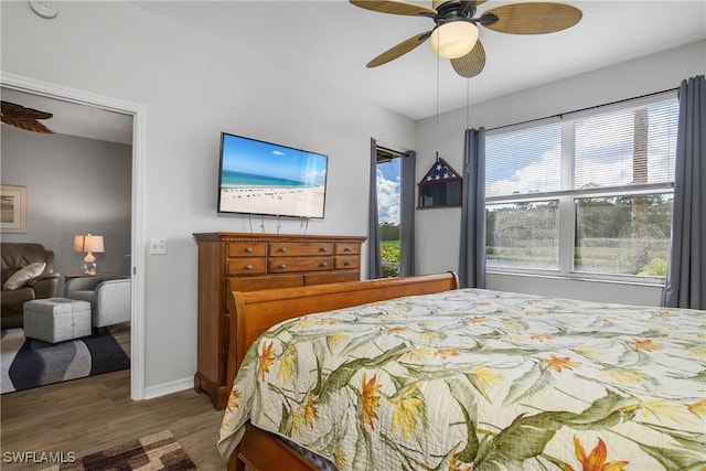 3760 Sawgrass Way Unit 3514, Naples, FL 34112 - bedroom with wood finished floors and ceiling fan
