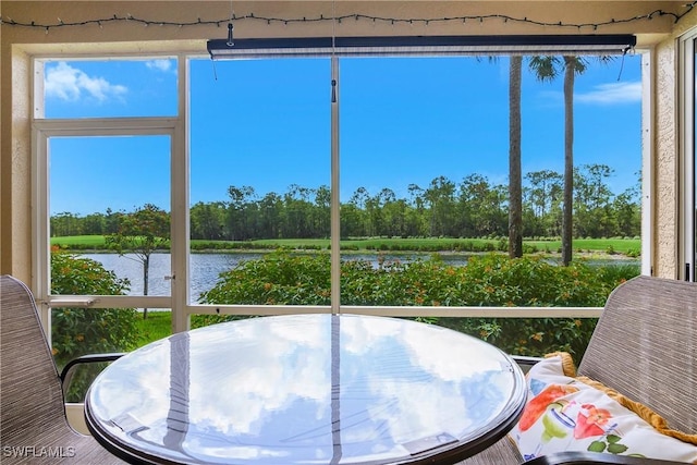3760 Sawgrass Way Unit 3514, Naples, FL 34112 - sunroom with a water view and view of scattered trees