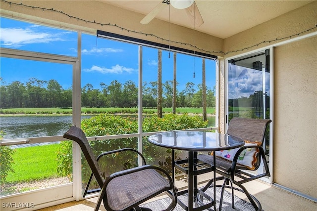 3760 Sawgrass Way Unit 3514, Naples, FL 34112 - sunroom / solarium featuring a ceiling fan, a water view, and view of wooded area
