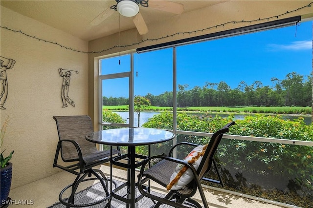 3760 Sawgrass Way Unit 3514, Naples, FL 34112 - sunroom with a water view and view of wooded area