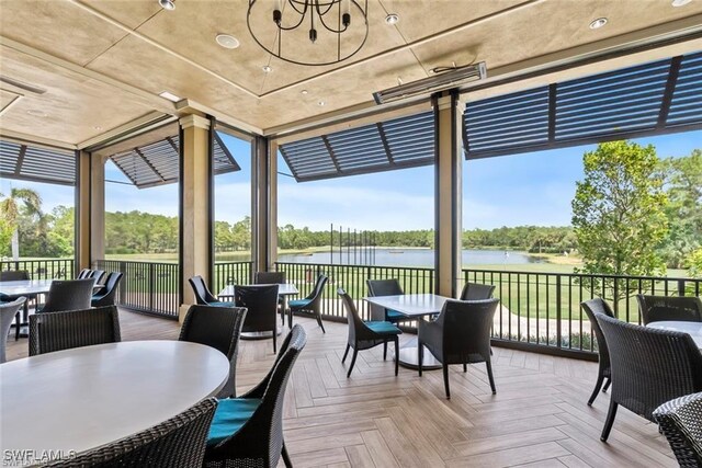3760 Sawgrass Way Unit 3514, Naples, FL 34112 - sunroom / solarium with expansive windows and a deck with water view
