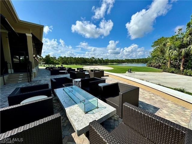 3760 Sawgrass Way Unit 3514, Naples, FL 34112 - view of patio featuring a water view, outdoor lounge area, and view of scattered trees