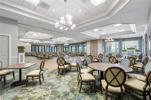 3760 Sawgrass Way Unit 3514, Naples, FL 34112 - dining space featuring a chandelier, a tray ceiling, ornamental molding, and healthy amount of natural light