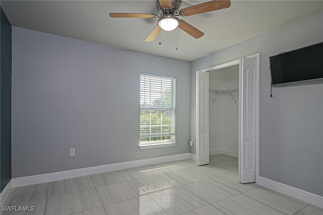 601 Clayton Ave, Lehigh Acres, FL 33972 - unfurnished bedroom featuring light tile patterned floors and a ceiling fan
