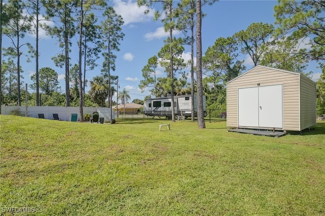 601 Clayton Ave, Lehigh Acres, FL 33972 - view of yard featuring a storage unit
