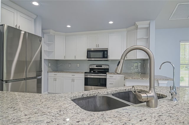 601 Clayton Ave, Lehigh Acres, FL 33972 - kitchen featuring appliances with stainless steel finishes, open shelves, white cabinetry, and recessed lighting