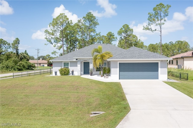 601 Clayton Ave, Lehigh Acres, FL 33972 - single story home featuring stucco siding, a garage, concrete driveway, and a shingled roof