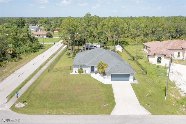601 Clayton Ave, Lehigh Acres, FL 33972 - view of subject property with a heavily wooded area