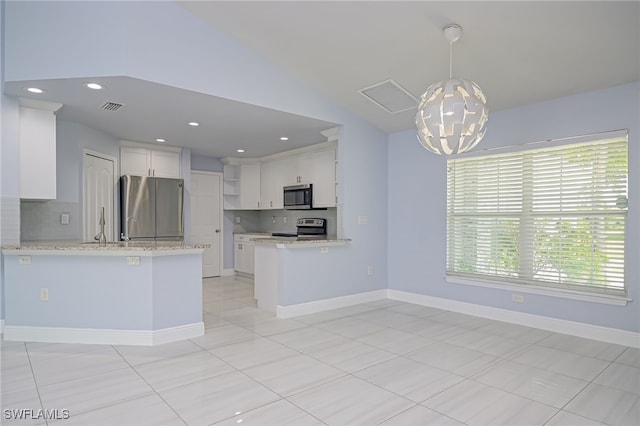 601 Clayton Ave, Lehigh Acres, FL 33972 - kitchen with appliances with stainless steel finishes, open shelves, a peninsula, white cabinets, and vaulted ceiling