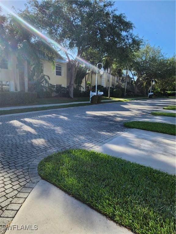 1240 Shady Rest Ln Unit 104, Naples, FL 34103 - view of yard with driveway