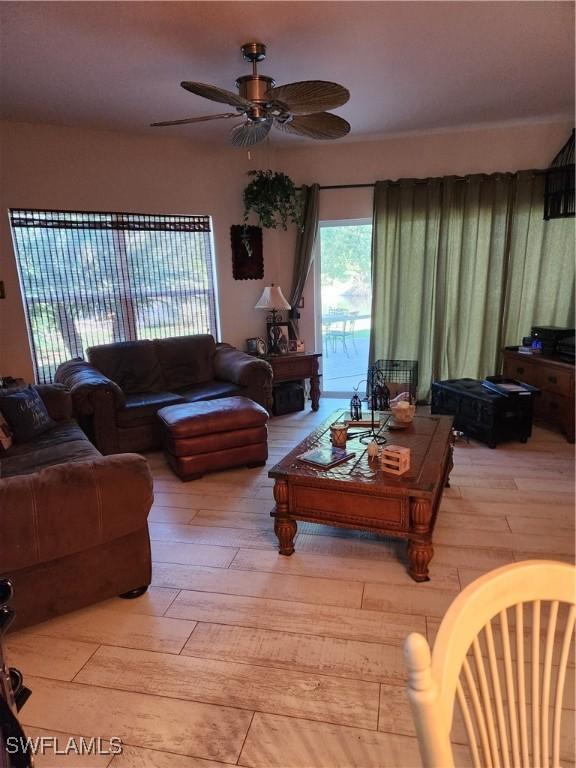 1240 Shady Rest Ln Unit 104, Naples, FL 34103 - living room with ceiling fan and light wood finished floors