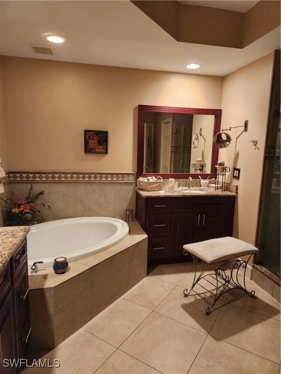 1240 Shady Rest Ln Unit 104, Naples, FL 34103 - full bath with vanity, a bath, tile patterned flooring, and recessed lighting