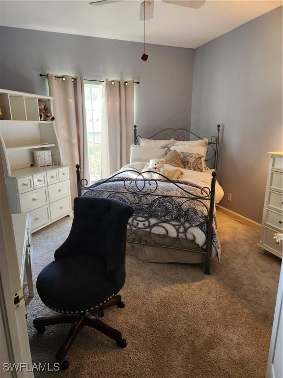 1240 Shady Rest Ln Unit 104, Naples, FL 34103 - bedroom with light carpet and ceiling fan