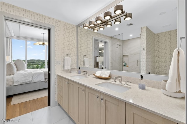 13925 Old Coast Rd Unit 403, Naples, FL 34110 - bathroom featuring double vanity, a shower stall, and ensuite bathroom
