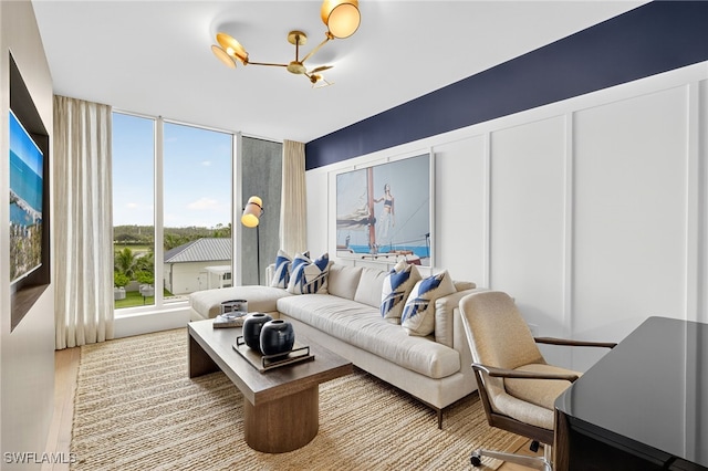 13925 Old Coast Rd Unit 403, Naples, FL 34110 - living area with a chandelier and wood finished floors