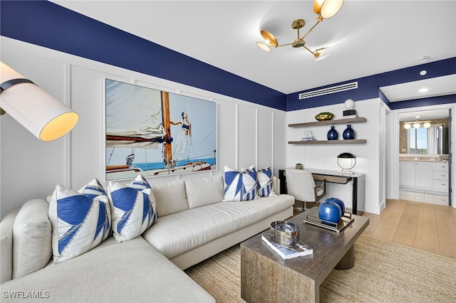 13925 Old Coast Rd Unit 403, Naples, FL 34110 - living area with a chandelier and wood finished floors