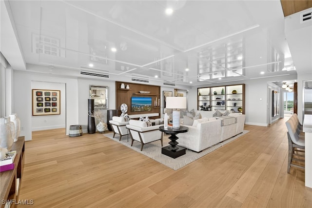 13925 Old Coast Rd Unit 403, Naples, FL 34110 - living room with wood finished floors, recessed lighting, and a wall mounted AC