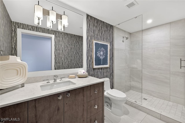 13925 Old Coast Rd Unit 403, Naples, FL 34110 - full bathroom featuring a shower stall, vanity, tile patterned flooring, and wallpapered walls