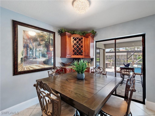 1431 SW 53rd Ln, Cape Coral, FL 33914 - dining room featuring light tile patterned floors and baseboards