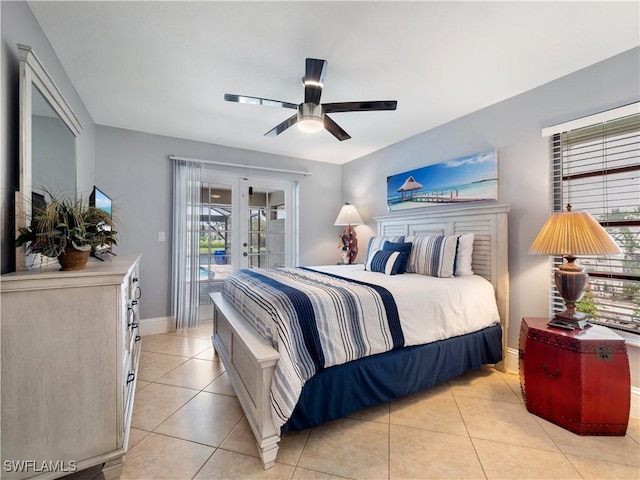 1431 SW 53rd Ln, Cape Coral, FL 33914 - bedroom featuring french doors, access to outside, light tile patterned floors, and ceiling fan